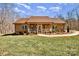 Inviting front exterior of a brick home with a cozy porch and manicured landscaping at 809 Liberty Rd, Gold Hill, NC 28071