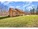 Charming brick home with a covered porch and well-manicured lawn in a serene setting at 809 Liberty Rd, Gold Hill, NC 28071