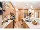 Well-lit kitchen featuring wood cabinets, stainless steel appliances, and white countertops at 809 Liberty Rd, Gold Hill, NC 28071