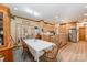 Open-concept kitchen and dining area with wood cabinets and floors, perfect for entertaining at 809 Liberty Rd, Gold Hill, NC 28071