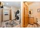 Laundry room with stackable washer and dryer, a half bath and an entrance to the garage at 809 Liberty Rd, Gold Hill, NC 28071