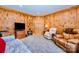 The living room features wood paneling and comfortable seating at 809 Liberty Rd, Gold Hill, NC 28071