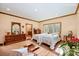 Sunlit main bedroom with hardwood floors, ensuite bathroom, and furniture at 809 Liberty Rd, Gold Hill, NC 28071