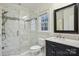 Beautiful bathroom featuring a spacious walk-in shower with unique tile and marble countertop at 9128 Summer Club Rd, Charlotte, NC 28277