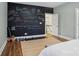 Unique bedroom features a chalkboard wall with custom artwork and writing, creating a fun and creative space at 9128 Summer Club Rd, Charlotte, NC 28277