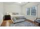 Bright bedroom features neutral color scheme, plush carpet, and a window for natural light at 9128 Summer Club Rd, Charlotte, NC 28277