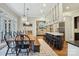 Bright kitchen boasts hardwood floors, a breakfast bar, and stainless steel appliances at 9128 Summer Club Rd, Charlotte, NC 28277
