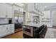 Bright kitchen boasts hardwood floors, a breakfast bar, and stainless steel appliances at 9128 Summer Club Rd, Charlotte, NC 28277