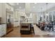 Charming kitchen features stainless steel appliances, a breakfast bar, and hardwood floors at 9128 Summer Club Rd, Charlotte, NC 28277