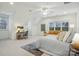 Bright main bedroom featuring a ceiling fan, a window, a work area, and a comfortable bed at 9128 Summer Club Rd, Charlotte, NC 28277
