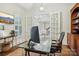Office featuring hardwood floors, a glass desk, and french doors at 9128 Summer Club Rd, Charlotte, NC 28277