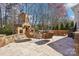 Spacious outdoor patio with a stone fireplace and comfortable seating at 9128 Summer Club Rd, Charlotte, NC 28277