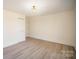 Spacious bedroom with neutral walls, light wood flooring, and ample closet space, providing a blank canvas at 922 Grace Ave, Kannapolis, NC 28083