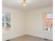Bright bedroom with neutral walls and large windows offering natural light and views of the outdoors at 922 Grace Ave, Kannapolis, NC 28083