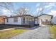 A charming home with white siding, a gravel driveway, and a convenient carport at 922 Grace Ave, Kannapolis, NC 28083