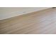 Light wood-look flooring with white baseboards at 922 Grace Ave, Kannapolis, NC 28083