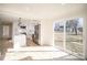 Modern kitchen featuring stainless steel appliances, white cabinets, and an adjacent dining area with sliding glass doors at 922 Grace Ave, Kannapolis, NC 28083