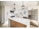 Modern kitchen featuring white cabinets, stainless steel appliances, and a center island at 922 Grace Ave, Kannapolis, NC 28083