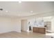 Open-concept living room showcasing the new flooring and kitchen at 922 Grace Ave, Kannapolis, NC 28083