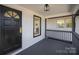 Cozy front porch showcasing the entrance, lighting, and gray railings at 922 Grace Ave, Kannapolis, NC 28083