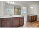 Modern bathroom with double vanities, large mirrors, and natural light at 9481 Coast Laurel Ave # 12, Concord, NC 28027