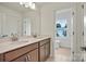 Bathroom with double vanity, large mirror and tiled floor at 9481 Coast Laurel Ave # 12, Concord, NC 28027