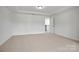Spacious carpeted bedroom featuring recessed lighting and a walk-in closet at 9481 Coast Laurel Ave # 12, Concord, NC 28027