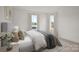 Neutral bedroom with plenty of natural light, soft textures and a soothing aesthetic at 9481 Coast Laurel Ave # 12, Concord, NC 28027