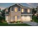 Charming two-story home with a two-car garage, brick accents, and beautifully landscaped yard at 9481 Coast Laurel Ave # 12, Concord, NC 28027