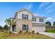Two-story home with brick and siding, and a well-manicured lawn at 9481 Coast Laurel Ave # 12, Concord, NC 28027