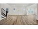 Spacious great room with light wood floors and lots of natural light at 9481 Coast Laurel Ave # 12, Concord, NC 28027