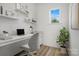 Bright home office with modern decor, desk, shelving and view of the outdoors at 9481 Coast Laurel Ave # 12, Concord, NC 28027