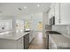 Bright, open kitchen with stainless appliances, an island sink, and expansive countertops at 9481 Coast Laurel Ave # 12, Concord, NC 28027