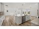 Open layout kitchen with a large center island perfect for cooking and entertaining at 9481 Coast Laurel Ave # 12, Concord, NC 28027