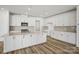 Elegant kitchen featuring a center island, subway tile backsplash, and stainless steel appliances at 9481 Coast Laurel Ave # 12, Concord, NC 28027