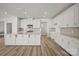 Modern kitchen with an island, sleek countertops, and a suite of stainless steel appliances at 9481 Coast Laurel Ave # 12, Concord, NC 28027