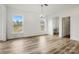 Bright living room featuring wood floors, ample natural light, and neutral color palette at 9481 Coast Laurel Ave # 12, Concord, NC 28027