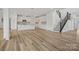 Open-concept living space with a staircase and flowing layout, bathed in natural light at 9481 Coast Laurel Ave # 12, Concord, NC 28027