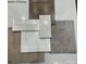 Close up on kitchen and flooring design featuring cabinet, counter top, tile and flooring samples at 9481 Coast Laurel Ave # 12, Concord, NC 28027