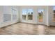 Inviting sun room with ample natural light, showcasing hardwood floors and scenic views at 9481 Coast Laurel Ave # 12, Concord, NC 28027