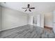 Spacious bedroom features gray flooring, a ceiling fan and natural light at 1001 Mesa Verde Dr, Fort Mill, SC 29707