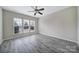 Large bedroom features gray flooring, a ceiling fan and natural light at 1001 Mesa Verde Dr, Fort Mill, SC 29707