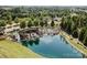 Aerial view showcasing the Sun City Carolina Lakes entrance, featuring a waterfall and lush greenery at 1001 Mesa Verde Dr, Fort Mill, SC 29707