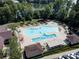 Aerial view of the community pool with ample seating, a spa, and shaded areas at 1001 Mesa Verde Dr, Fort Mill, SC 29707