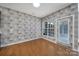 Dining area featuring hardwood floors, patterned wallpaper and natural light at 1001 Mesa Verde Dr, Fort Mill, SC 29707