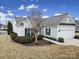 Well-maintained single-story house featuring manicured landscaping, windows, and a two-car garage at 1001 Mesa Verde Dr, Fort Mill, SC 29707