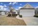 Charming single Gathering home featuring a manicured lawn and a two car garage with attached driveway at 1001 Mesa Verde Dr, Fort Mill, SC 29707