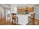 Open concept kitchen featuring granite countertops, stainless steel appliances, and breakfast bar at 1001 Mesa Verde Dr, Fort Mill, SC 29707