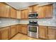 Well-lit kitchen boasting granite countertops and stainless steel oven and microwave at 1001 Mesa Verde Dr, Fort Mill, SC 29707