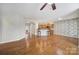 Open concept living room next to kitchen features hardwood floors and natural light at 1001 Mesa Verde Dr, Fort Mill, SC 29707